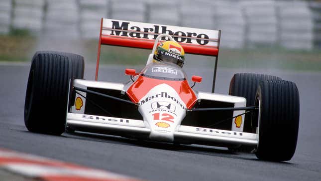 A photo of Ayrton Senna racing in his Mclaren F1 car. 