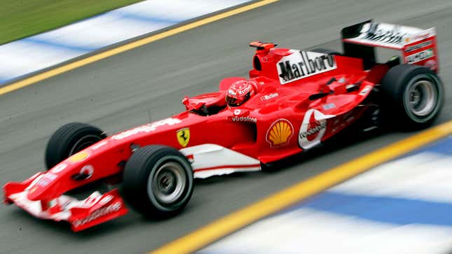 A photo of Michael Schumacher in his Ferrari F1 car. 