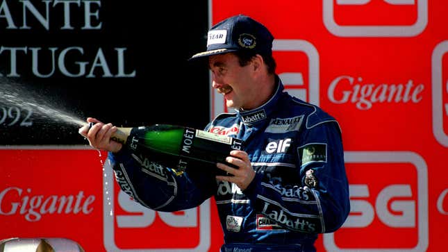 A photo of Nigel Mansell on the podium after an F1 race. 